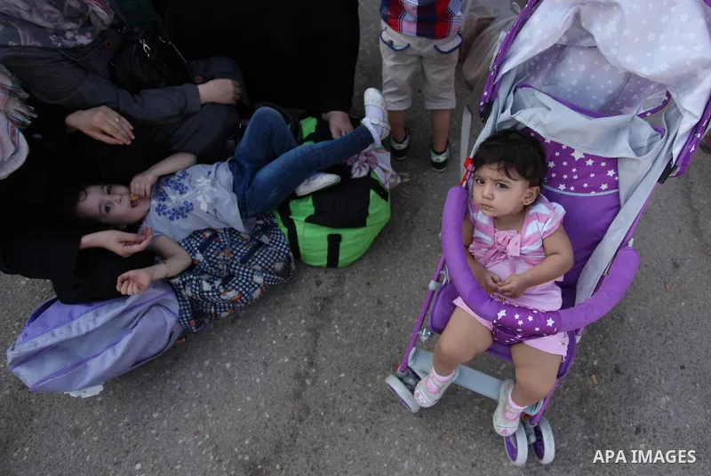 Palestinians wait for travel permits to cross into Egypt through the Rafah border crossing after it was opened by Egyptian authorities, in the southern Gaza Strip September 3, 2016. Photo by Ashraf Amra