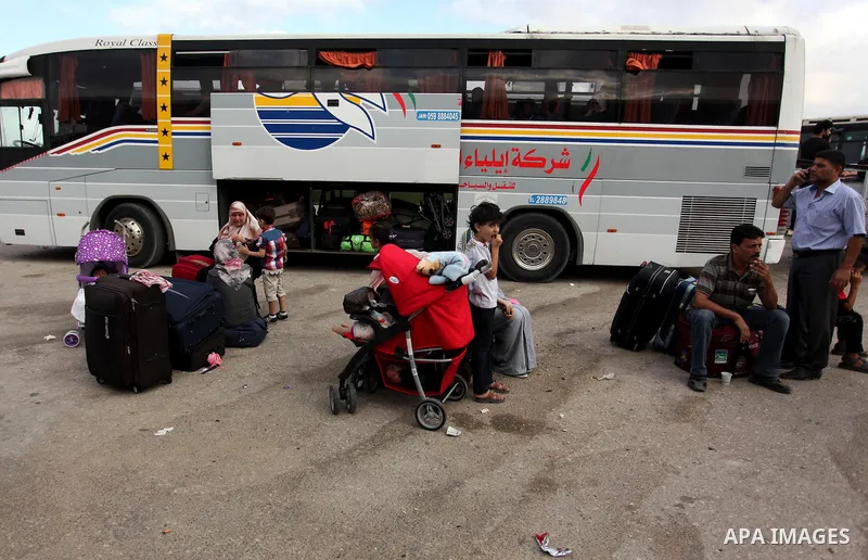 Palestinians wait for travel permits to cross into Egypt through the Rafah border crossing after it was opened by Egyptian authorities, in the southern Gaza Strip September 3, 2016. Photo by Ashraf Amra