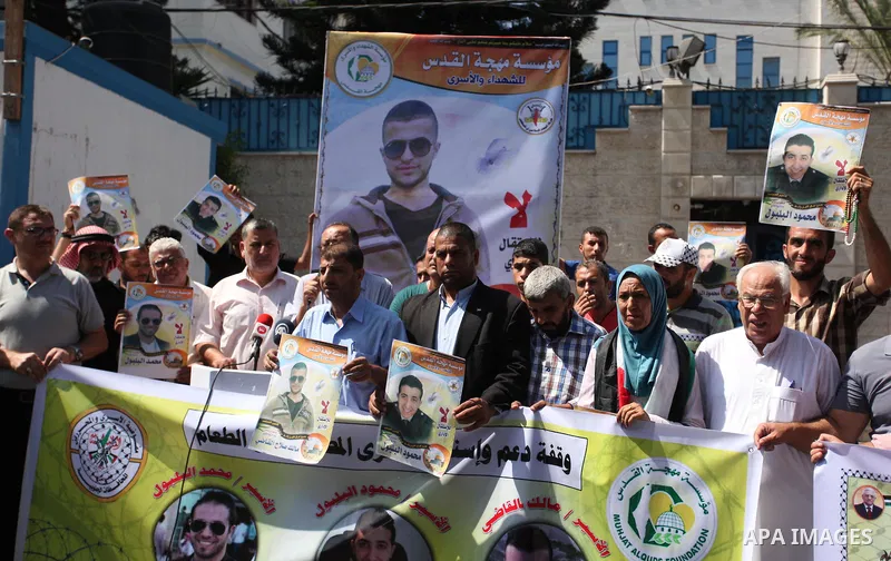 Palestinians hold banners during a protest to show solidarity with Palestinian prisoners on hunger strike in Israeli Jails, in front of the high commissioner for human rights headquarters in Gaza City, on Sept. 04, 2016....