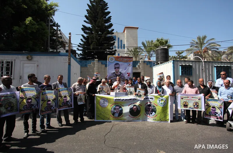 Palestinians hold banners during a protest to show solidarity with Palestinian prisoners on hunger strike in Israeli Jails, in front of the high commissioner for human rights headquarters in Gaza City, on Sept. 04, 2016....