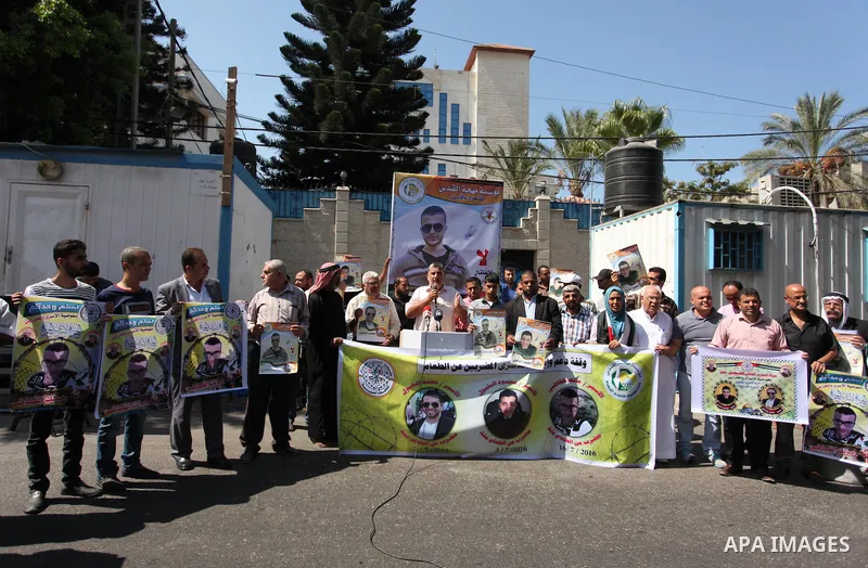 Palestinians hold banners during a protest to show solidarity with Palestinian prisoners on hunger strike in Israeli Jails, in front of the high commissioner for human rights headquarters in Gaza City, on Sept. 04, 2016....