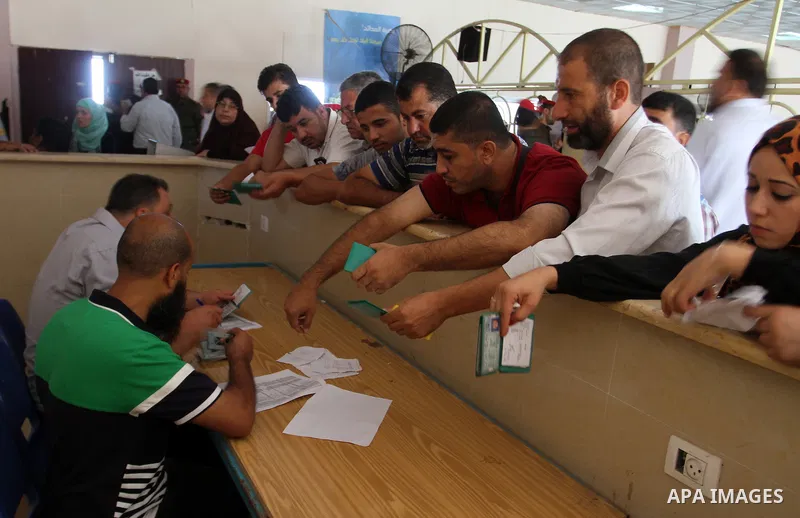 Palestinians wait for travel permits to cross into Egypt through the Rafah border crossing, on September 4, 2016 in the southern Gaza Strip. Egyptian authorities temporarily reopened it both directions for two days in Ga...