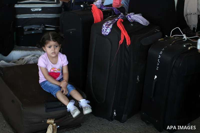 Palestinians wait for travel permits to cross into Egypt through the Rafah border crossing, on September 4, 2016 in the southern Gaza Strip. Egyptian authorities temporarily reopened it both directions for two days in Ga...