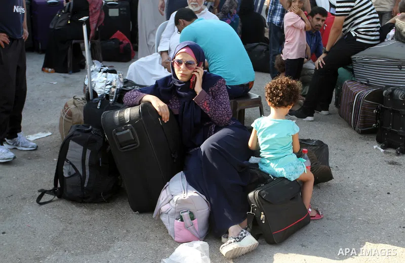 Palestinians wait for travel permits to cross into Egypt through the Rafah border crossing, on September 4, 2016 in the southern Gaza Strip. Egyptian authorities temporarily reopened it both directions for two days in Ga...