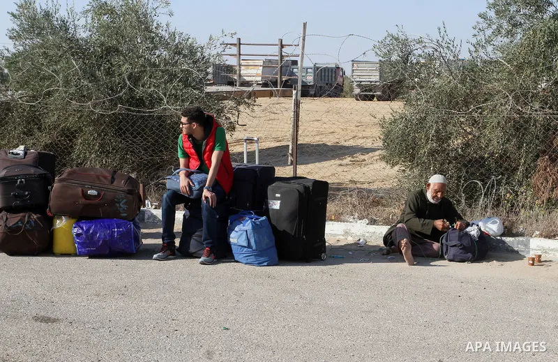 Palestinians wait for travel permits to cross into Egypt through the Rafah border crossing, on September 4, 2016 in the southern Gaza Strip. Egyptian authorities temporarily reopened it both directions for two days in Ga...