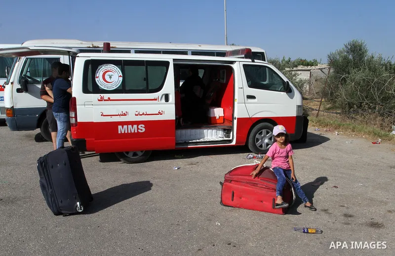 Palestinians wait for travel permits to cross into Egypt through the Rafah border crossing, on September 4, 2016 in the southern Gaza Strip. Egyptian authorities temporarily reopened it both directions for two days in Ga...