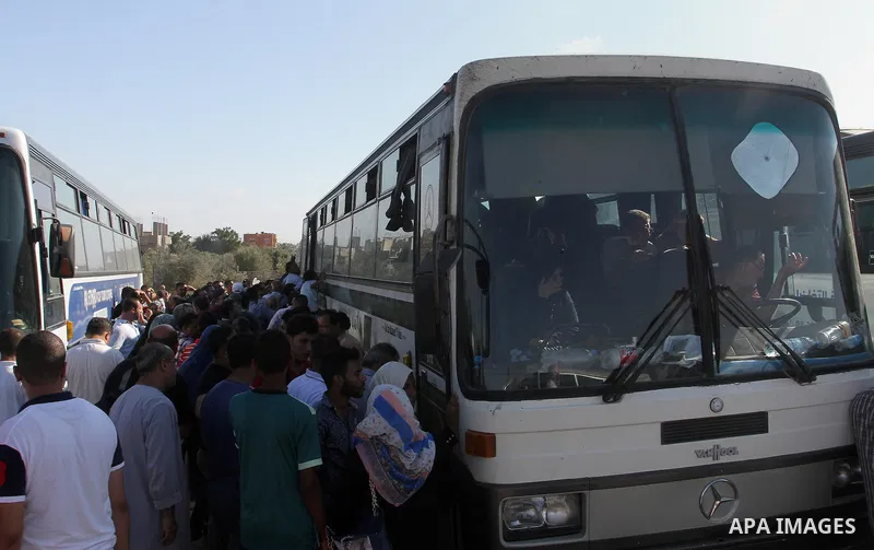 Palestinians wait for travel permits to cross into Egypt through the Rafah border crossing, on September 4, 2016 in the southern Gaza Strip. Egyptian authorities temporarily reopened it both directions for two days in Ga...