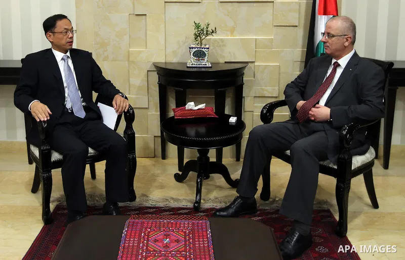 Palestinian Prime Minister Rami Hamdallah meets with Chinese Ambassador to Palestine Chen Xingzhong, in the West Bank city of Ramallah, on Sep. 04, 2016. Photo by Prime Minister Office