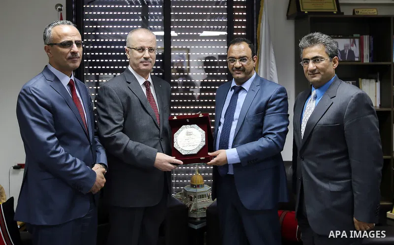 Palestinian Prime Minister Rami Hamdallah visits the headquarters of the general Prosecutor's office in the West Bank city of Ramallah, on Sep. 04, 2016. Photo by Prime Minister Office
