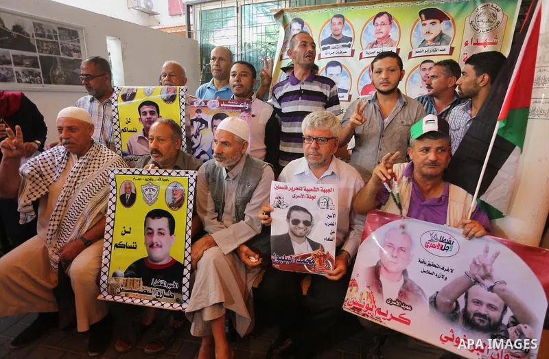 Palestinians take part in a protest demanding release the prisoners in Israeli jails, in front of Red cross office in Gaza city, on Sept. 05, 2016. Photo by Mohammed Asad