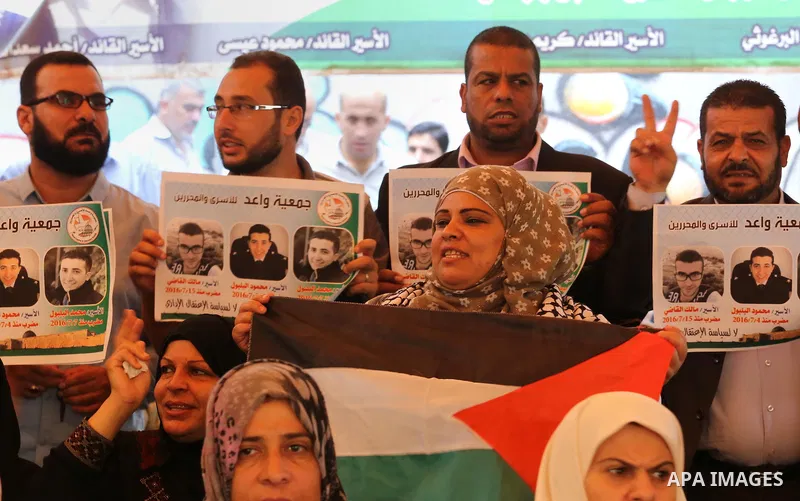 Palestinians take part in a protest demanding release the prisoners in Israeli jails, in front of Red cross office in Gaza city, on Sept. 05, 2016. Photo by Mohammed Asad