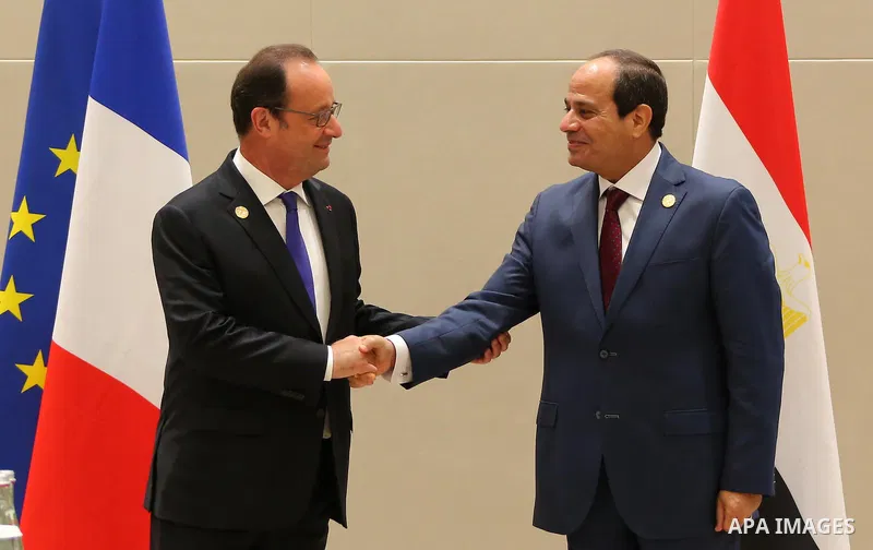 French President Francois Hollande (L) shakes hands with Egypt's President Abdel Fattah al-Sisi (R) at a sideline meeting on the G20 Summit in Hangzhou on September 5, 2016. G20 leaders confront a sluggish global economy...