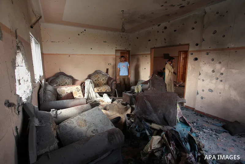 Palestinians from the al-Shanti family check the damage in their house after it was hit by Israeli tank fire on September 6, 2016 in Beit Hanun in the northern Gaza Strip. Israel's army targeted Hamas posts in the Gaza S...