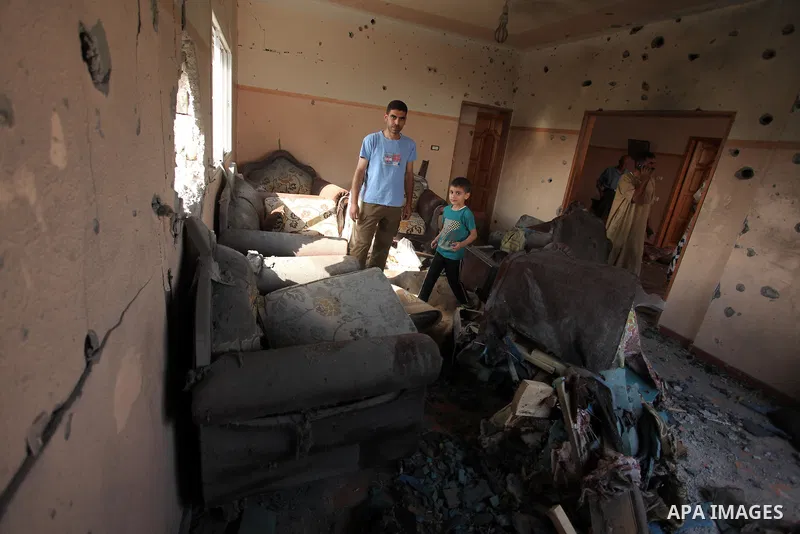 Palestinians from the al-Shanti family check the damage in their house after it was hit by Israeli tank fire on September 6, 2016 in Beit Hanun in the northern Gaza Strip. Israel's army targeted Hamas posts in the Gaza S...