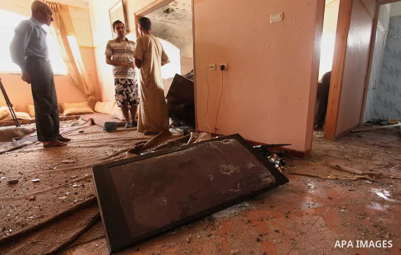 Palestinians from the al-Shanti family check the damage in their house after it was hit by Israeli tank fire on September 6, 2016 in Beit Hanun in the northern Gaza Strip. Israel's army targeted Hamas posts in the Gaza S...