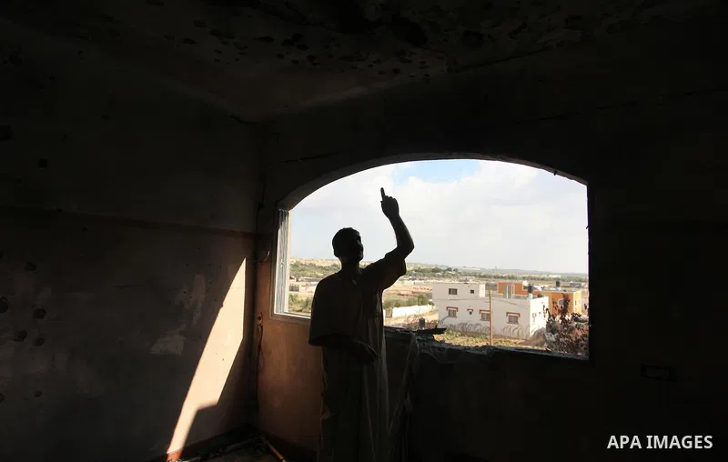 A Palestinian man inspects his house after it was hit by Israeli tank fire on September 6, 2016 in Beit Hanun in the northern Gaza Strip. Israel's army targeted Hamas posts in the Gaza Strip with tank fire after gunfire...