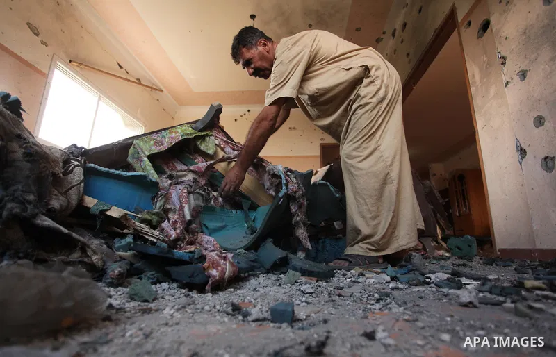A Palestinian man inspects his house after it was hit by Israeli tank fire on September 6, 2016 in Beit Hanun in the northern Gaza Strip. Israel's army targeted Hamas posts in the Gaza Strip with tank fire after gunfire...
