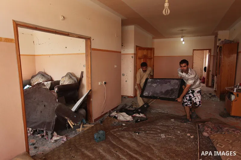 Palestinians from the al-Shanti family check the damage in their house after it was hit by Israeli tank fire on September 6, 2016 in Beit Hanun in the northern Gaza Strip. Israel's army targeted Hamas posts in the Gaza S...
