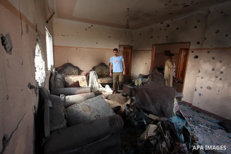 Palestinians from the al-Shanti family check the damage in their house after it was hit by Israeli tank fire on September 6, 2016 in Beit Hanun in the northern Gaza Strip. Israel's army targeted Hamas posts in the Gaza S...