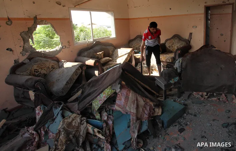 A Palestinian man inspects his house after it was hit by Israeli tank fire on September 6, 2016 in Beit Hanun in the northern Gaza Strip. Israel's army targeted Hamas posts in the Gaza Strip with tank fire after gunfire...