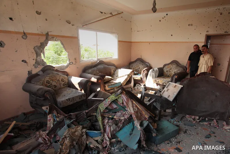 Palestinians from the al-Shanti family check the damage in their house after it was hit by Israeli tank fire on September 6, 2016 in Beit Hanun in the northern Gaza Strip. Israel's army targeted Hamas posts in the Gaza S...