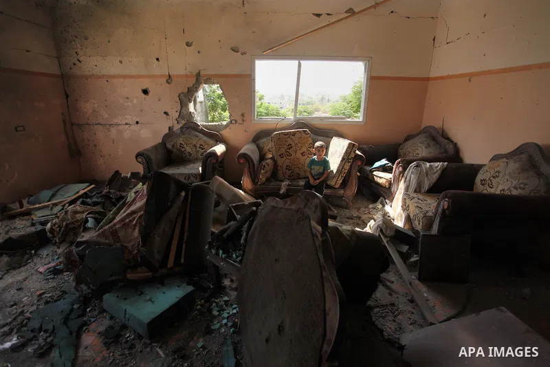 Palestinians from the al-Shanti family check the damage in their house after it was hit by Israeli tank fire on September 6, 2016 in Beit Hanun in the northern Gaza Strip. Israel's army targeted Hamas posts in the Gaza S...