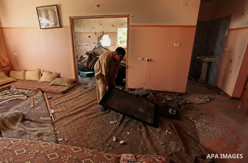 A Palestinian man inspects his house after it was hit by Israeli tank fire on September 6, 2016 in Beit Hanun in the northern Gaza Strip. Israel's army targeted Hamas posts in the Gaza Strip with tank fire after gunfire...