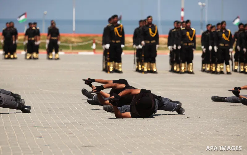 Members of the Palestinian security forces take part in a graduation ceremony in Gaza City on September 6, 2016. Photo by Ashraf Amra