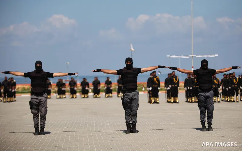 Members of the Palestinian security forces take part in a graduation ceremony in Gaza City on September 6, 2016. Photo by Ashraf Amra