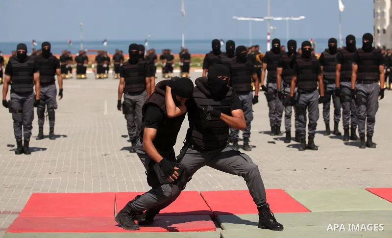 Members of the Palestinian security forces take part in a graduation ceremony in Gaza City on September 6, 2016. Photo by Ashraf Amra