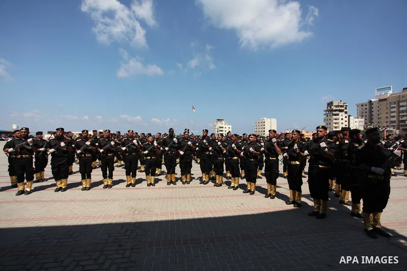 Members of the Palestinian security forces take part in a graduation ceremony in Gaza City on September 6, 2016. Photo by Ashraf Amra