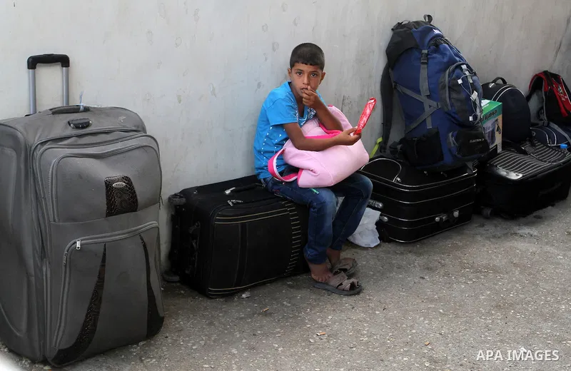 Palestinians wait for travel permits to cross into Egypt through the Rafah border crossing, on September 6, 2016 in the southern Gaza Strip. Egyptian authorities temporarily reopened it both directions in Gaza Strip, pat...