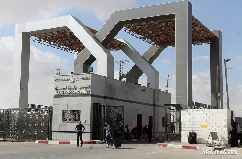 Palestinians wait for travel permits to cross into Egypt through the Rafah border crossing, on September 6, 2016 in the southern Gaza Strip. Egyptian authorities temporarily reopened it both directions in Gaza Strip, pat...