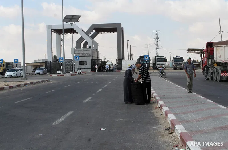 Palestinians wait for travel permits to cross into Egypt through the Rafah border crossing, on September 6, 2016 in the southern Gaza Strip. Egyptian authorities temporarily reopened it both directions in Gaza Strip, pat...