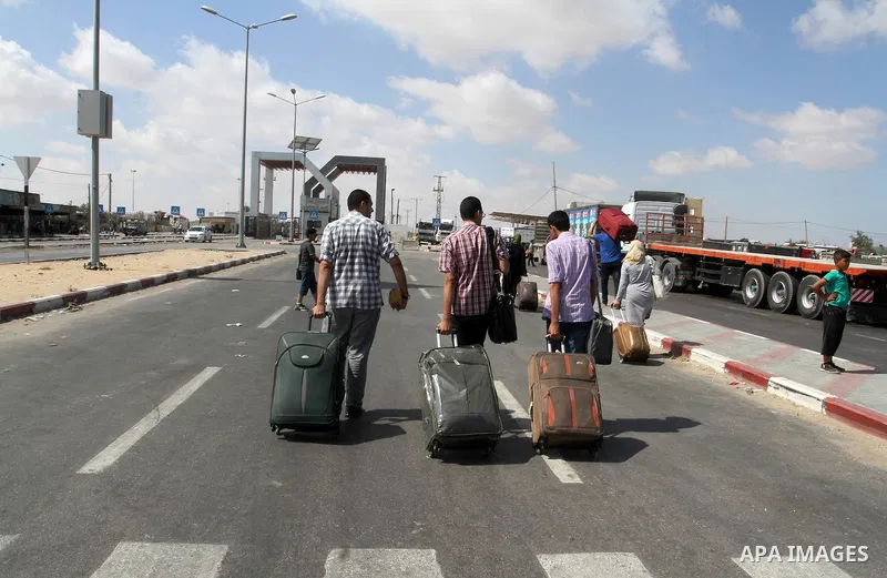 Palestinians wait for travel permits to cross into Egypt through the Rafah border crossing, on September 6, 2016 in the southern Gaza Strip. Egyptian authorities temporarily reopened it both directions in Gaza Strip, pat...