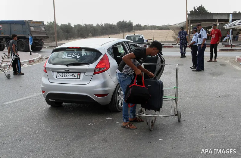 Palestinians wait for travel permits to cross into Egypt through the Rafah border crossing, on September 6, 2016 in the southern Gaza Strip. Egyptian authorities temporarily reopened it both directions in Gaza Strip, pat...