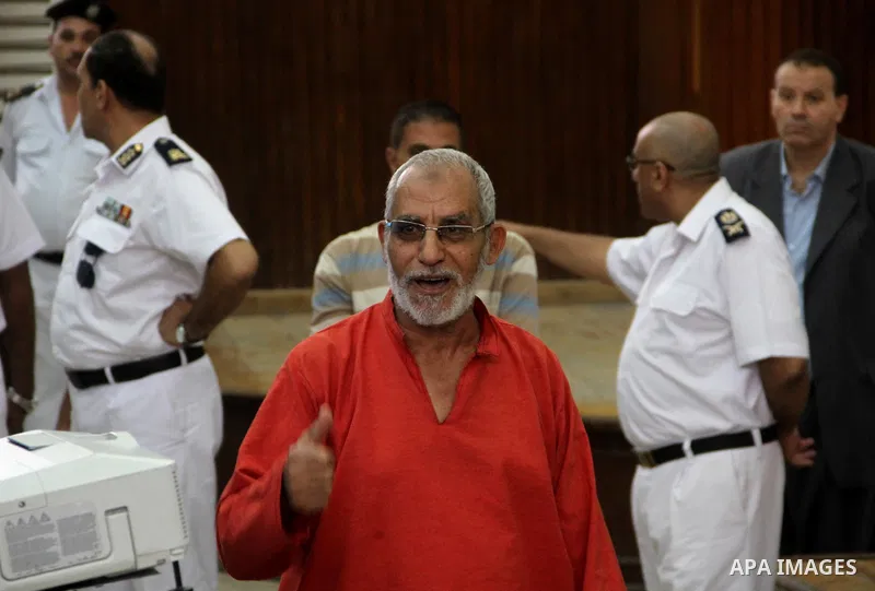 Egyptian Muslim Brotherhood leader Mohamed Badie gestures during his trial in a case known in media as "Rabaa Operations Room", in Cairo, on Sep. 06, 2016. Photo by Amr Sayed