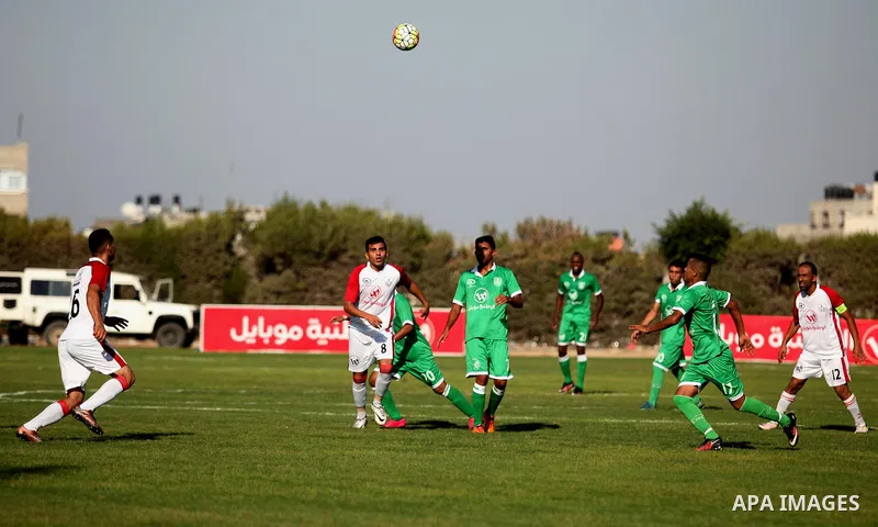 Palestinian Shabab Khan Younis players and Khadamat Rafah players compete during Super Cup soccer match at Yarmouk Stadium, in Gaza city on Sep. 09, 2016. Photo by Ashraf Amra