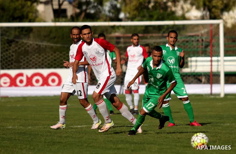Palestinian Shabab Khan Younis players and Khadamat Rafah players compete during Super Cup soccer match at Yarmouk Stadium, in Gaza city on Sep. 09, 2016. Photo by Ashraf Amra