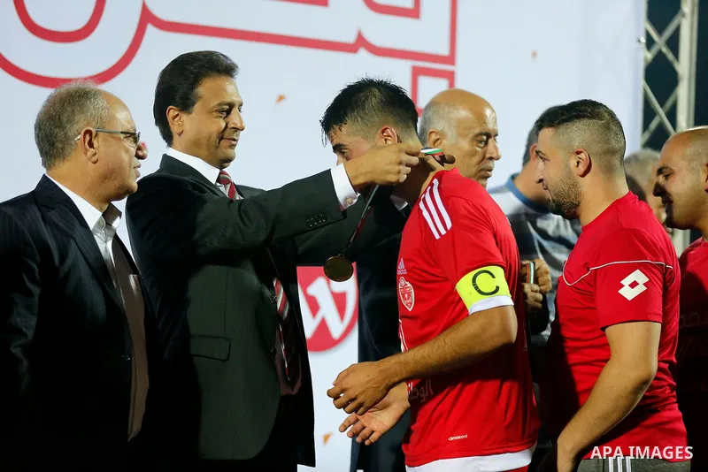 Players of Hebron's Ahly al-Khalil football club celebrate after beating Hebron's Shabab al-Khalil during Super Cup soccer match, in the West Bank city of Hebron, on Sep. 09, 2016. Photo by Wisam Hashlamoun
