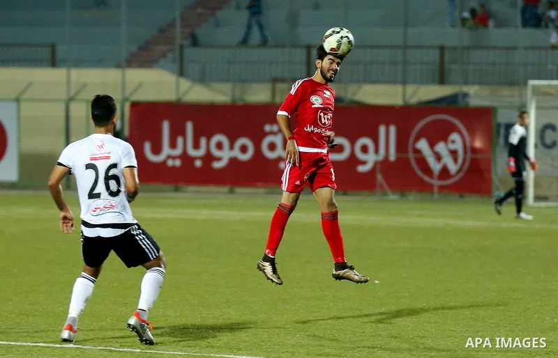 Players of Hebron's Ahly al-Khalil football club and players of Hebron's Shabab al-Khalil club compete during Super Cup soccer match, in the West Bank city of Hebron, on Sep. 09, 2016. Photo by Wisam Hashlamoun
