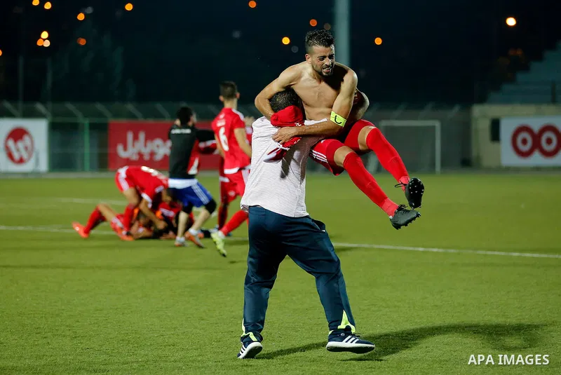 Players of Hebron's Ahly al-Khalil football club celebrate after beating Hebron's Shabab al-Khalil during Super Cup soccer match, in the West Bank city of Hebron, on Sep. 09, 2016. Photo by Wisam Hashlamoun