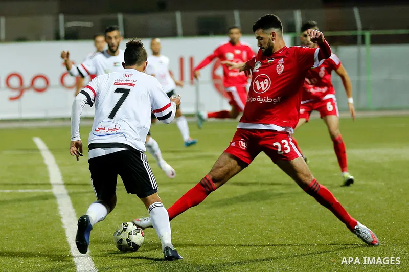 Players of Hebron's Ahly al-Khalil football club and players of Hebron's Shabab al-Khalil club compete during Super Cup soccer match, in the West Bank city of Hebron, on Sep. 09, 2016. Photo by Wisam Hashlamoun