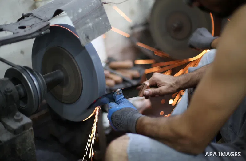A Palestinian man sharpen knives at his workshop in Gaza city on Sept. 10, 2016. The knives use to slaughter cattle and sheep for the Muslim holiday of Eid al-Adha or the Feast of Sacrifice, which marks the end of the an...