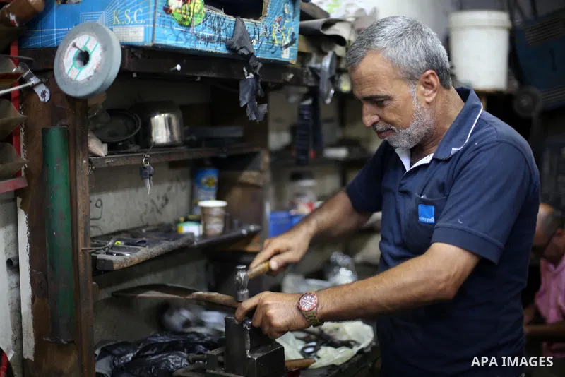 A Palestinian man sharpen knives at his workshop in Gaza city on Sept. 10, 2016. The knives use to slaughter cattle and sheep for the Muslim holiday of Eid al-Adha or the Feast of Sacrifice, which marks the end of the an...
