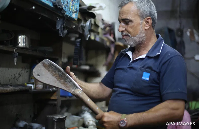 A Palestinian man sharpen knives at his workshop in Gaza city on Sept. 10, 2016. The knives use to slaughter cattle and sheep for the Muslim holiday of Eid al-Adha or the Feast of Sacrifice, which marks the end of the an...