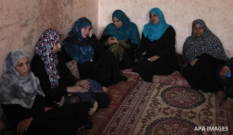 Relatives of Abdel-Rahman Al-Dabbagh, an 18-year-old Palestinian who was killed on Friday during a rock-throwing protest near the Gaza-Israel border, mourn during his funeral in central Gaza Strip September 10, 2016. Pho...