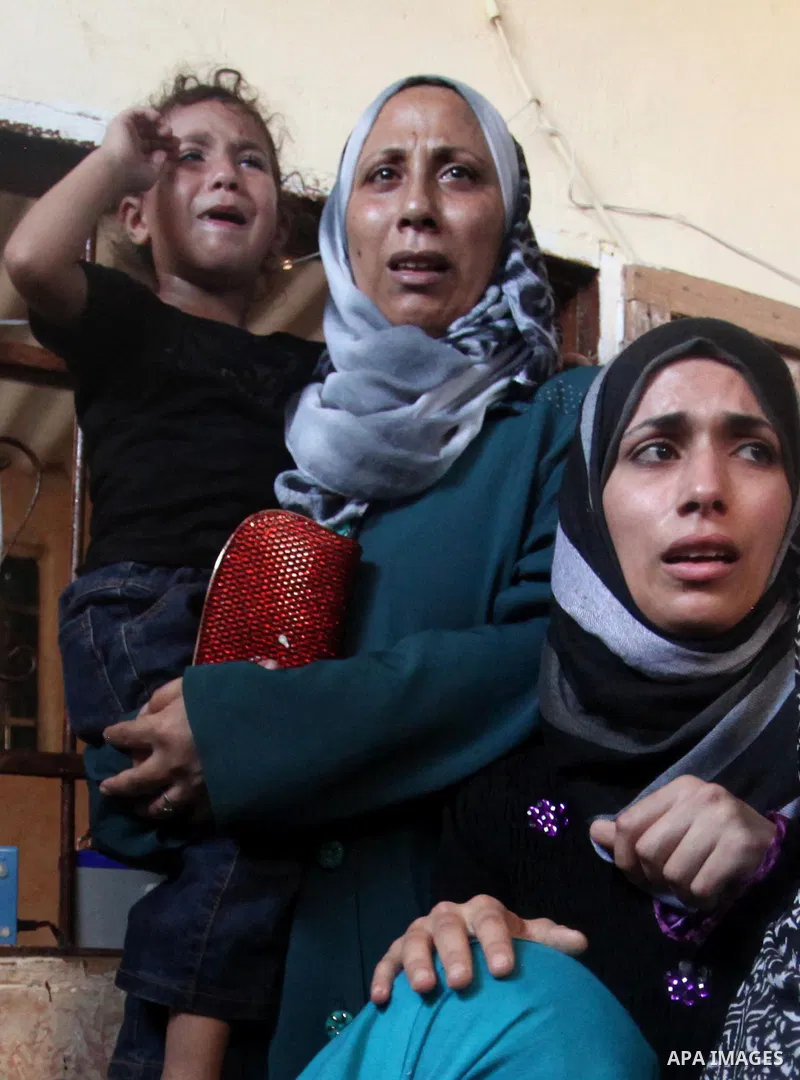 Relatives of Abdel-Rahman Al-Dabbagh, an 18-year-old Palestinian who was killed on Friday during a rock-throwing protest near the Gaza-Israel border, mourn during his funeral in central Gaza Strip September 10, 2016. Pho...