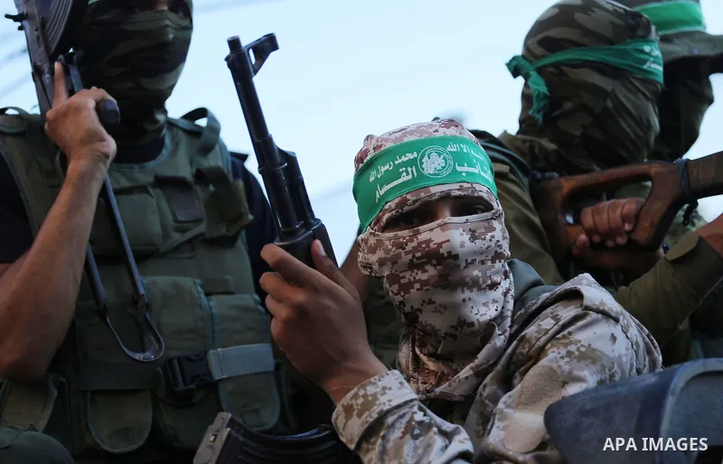 Palestinian militants of the Ezzedine al-Qassam Brigades, Hamas' armed wing, take part in a military parade to celebrate the Muslim festival of Eid al-Adha, in Gaza city, on Sep. 10, 2016. Photo by Mohammed Asad