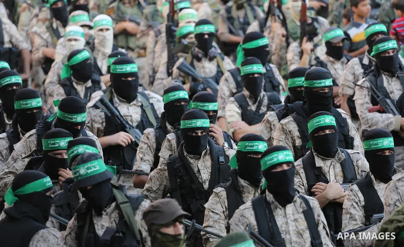 Palestinian militants of the Ezzedine al-Qassam Brigades, Hamas' armed wing, take part in a military parade to celebrate the Muslim festival of Eid al-Adha, in Gaza city, on Sep. 10, 2016. Photo by Mohammed Asad